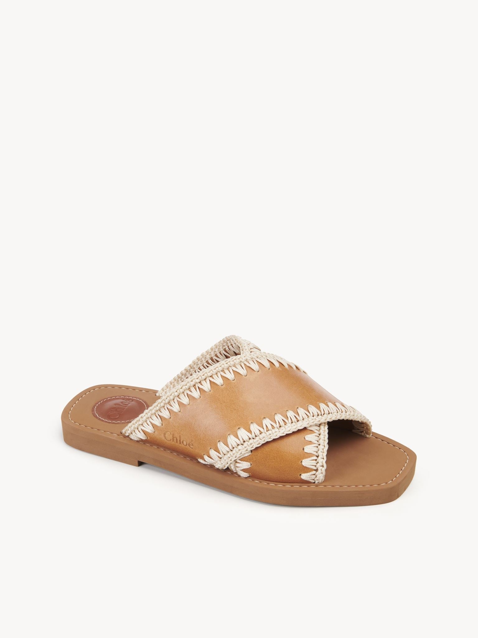 Mules plates Woody croisées en cuir - Luminous Ochre
