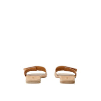 Mules plates en cuir à motif monogramme - Pale Nude