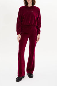 Pantalon effet peau de pêche coupe flare - Framboise