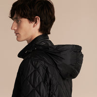BLACK Veste matelassée à capuche repliable