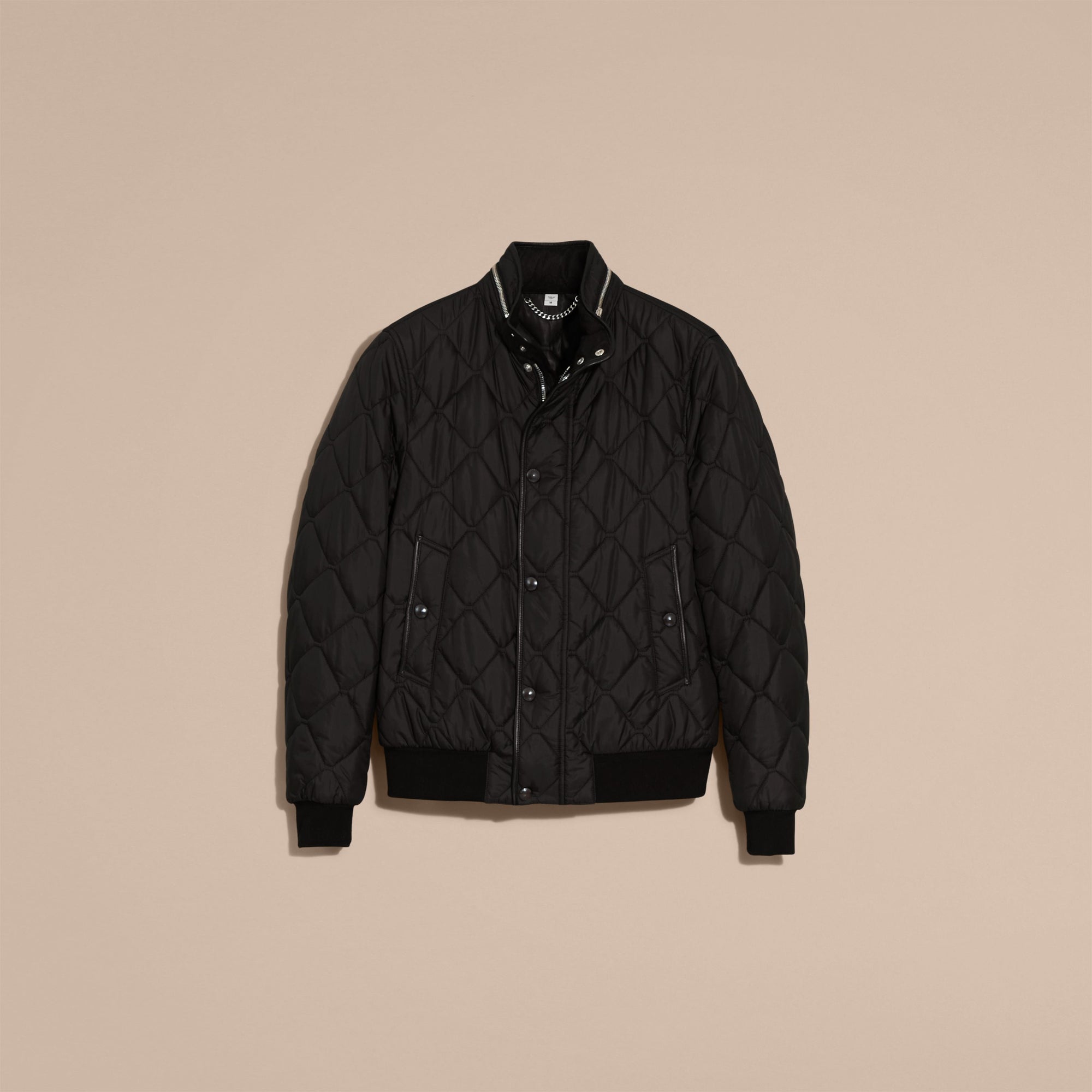 BLACK Veste matelassée à capuche repliable