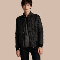 BLACK Veste matelassée à capuche repliable