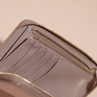 PALE GREY Portefeuille zippé en cuir London verni