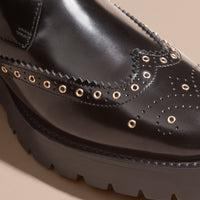 BLACK Bottines à bout golf en cuir et shearling