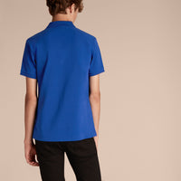 BRILLIANT BLUE Polo en piqué de coton avec patte à motif check