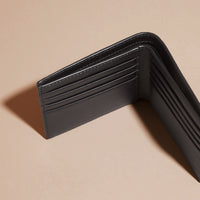 BLACK Portefeuille à rabat multidevise en cuir clouté