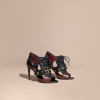 BORDEAUX Bottines en cuir et peau de serpent avec boucle et découpes