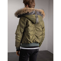 CAPER GREEN Veste rembourrée en duvet de canard avec capuche en fourrure de raton laveur et shearling