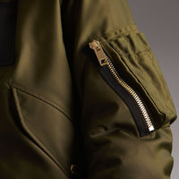 CAPER GREEN Veste rembourrée en duvet de canard avec capuche en fourrure de raton laveur et shearling