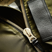 CAPER GREEN Veste rembourrée en duvet de canard avec capuche en fourrure de raton laveur et shearling