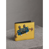 Portefeuille à rabat multidevise en cuir avec appliqué Créature - Jaune Ocre
