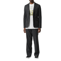 Pantalon de costume ample en laine stretch à fines rayures - Noir