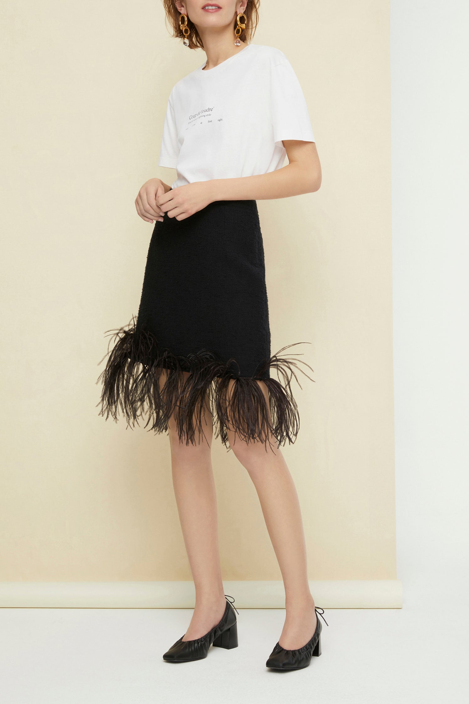 Jupe courte en tweed à plumes - Noir